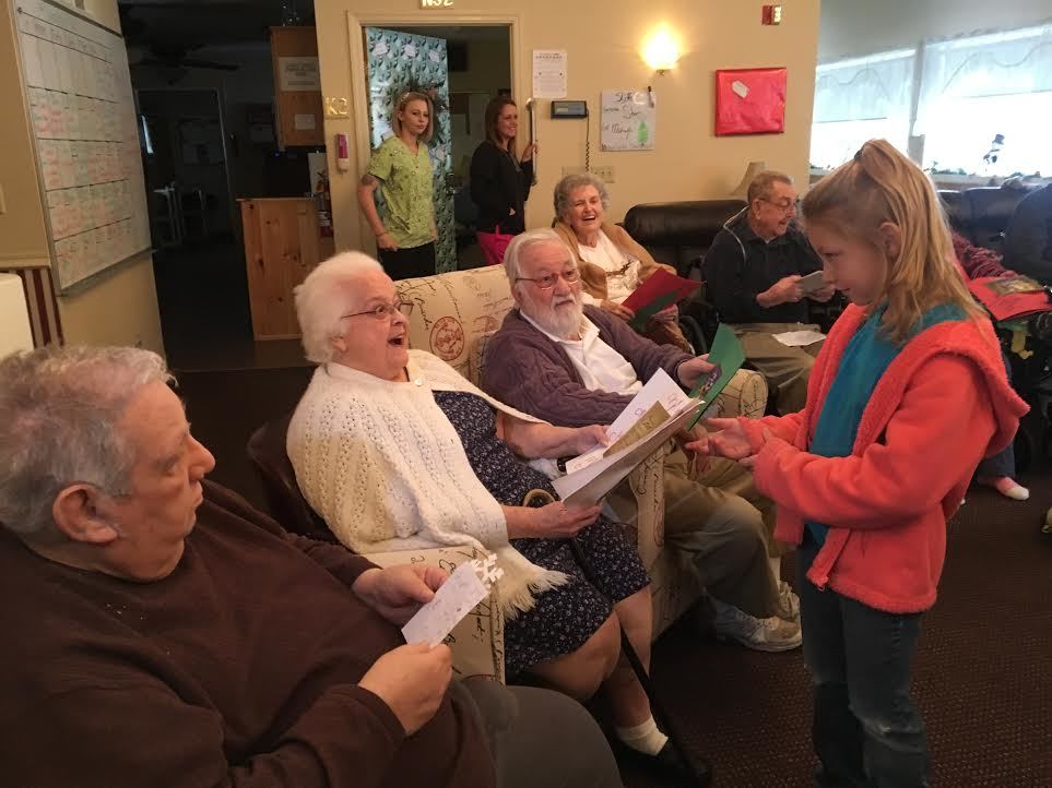 Students visit residents at personal care home to spread holiday cheer