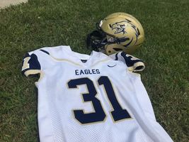 FOOTBALL TEAM HONORS STEVE DORMAN BY WEARING NO. 31